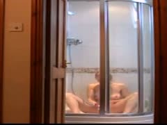 Hidden cam capturing video of a gorgeous wife masturbating while taking a shower 